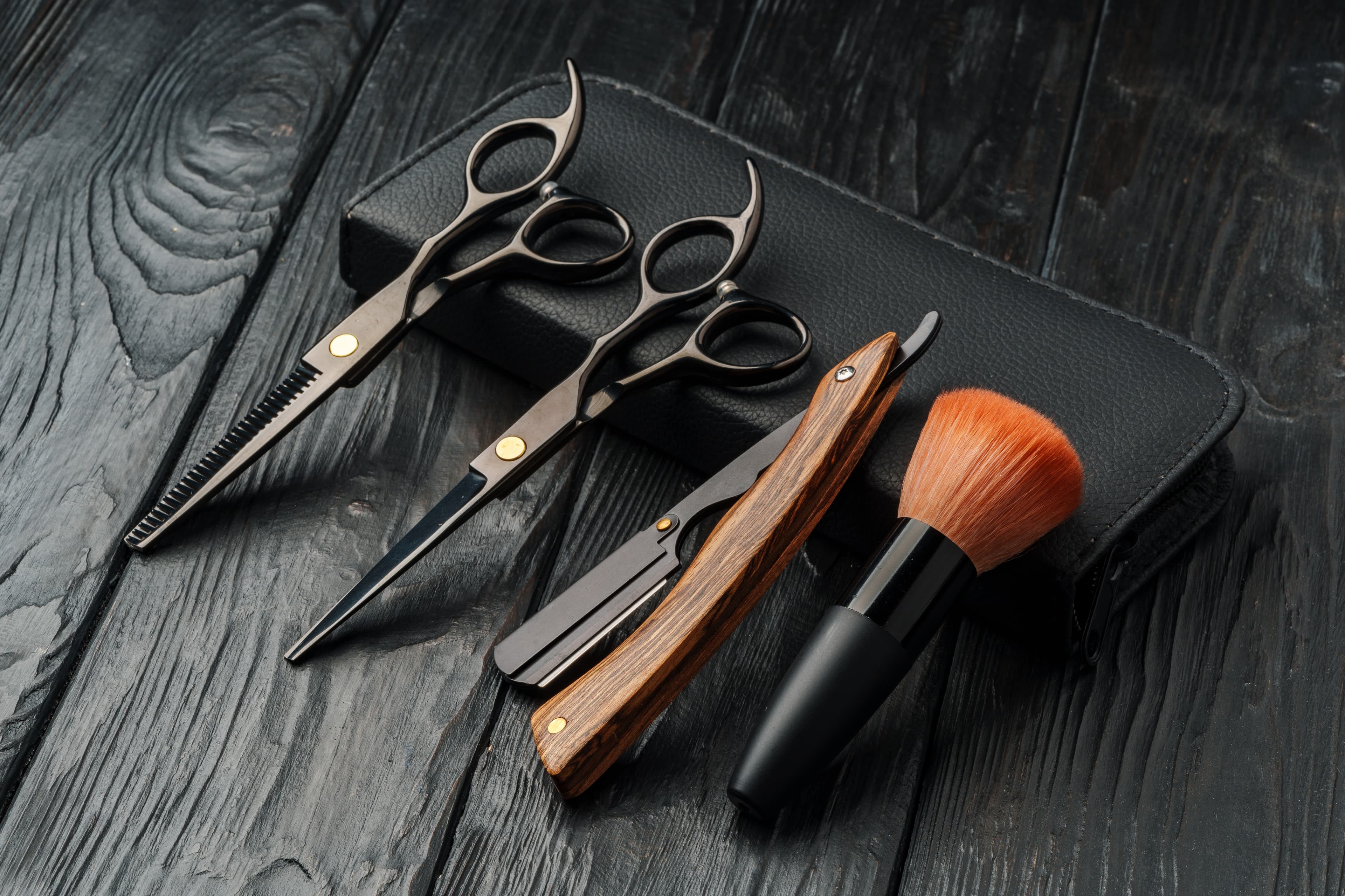 Barber tools laid out on a wooden table